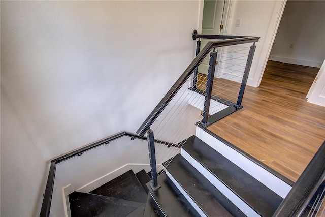 312 Beckham St, Sulphur Springs, TX 75482 - stairway featuring wood finished floors and baseboards