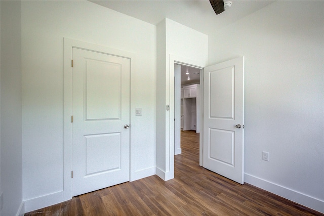312 Beckham St, Sulphur Springs, TX 75482 - unfurnished bedroom featuring baseboards and dark wood-style flooring