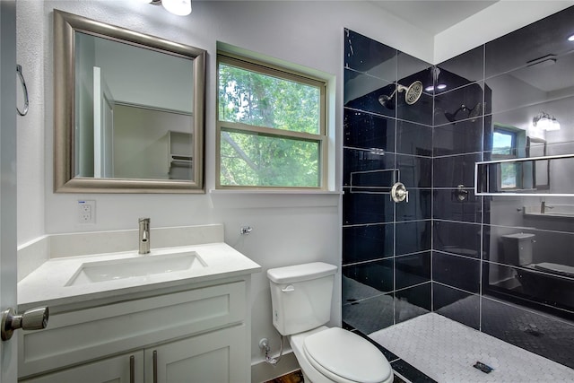 312 Beckham St, Sulphur Springs, TX 75482 - full bath featuring toilet, vanity, walk in shower, and plenty of natural light