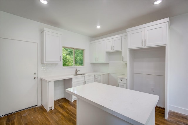 312 Beckham St, Sulphur Springs, TX 75482 - kitchen with backsplash, recessed lighting, white cabinetry, and a sink