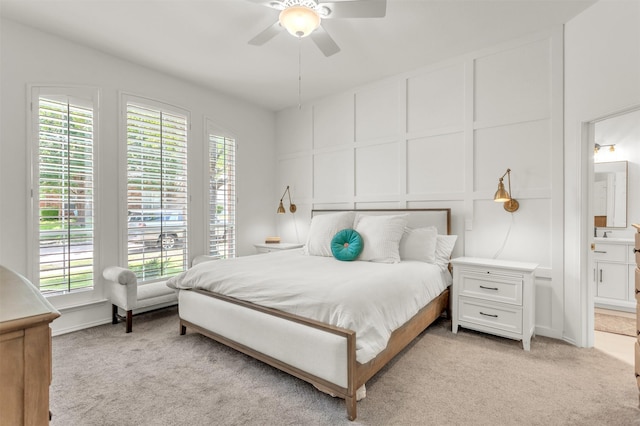 2081 Ashbourne Dr, Rockwall, TX 75087 - bedroom featuring a decorative wall, light carpet, ensuite bathroom, and a ceiling fan