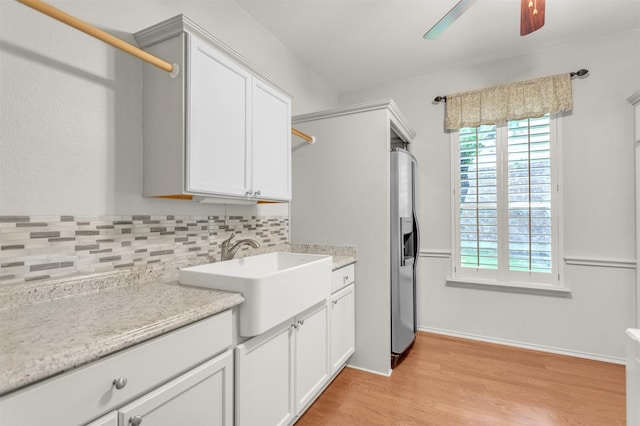 2081 Ashbourne Dr, Rockwall, TX 75087 - washroom featuring a sink, a ceiling fan, healthy amount of natural light, and light wood-style flooring