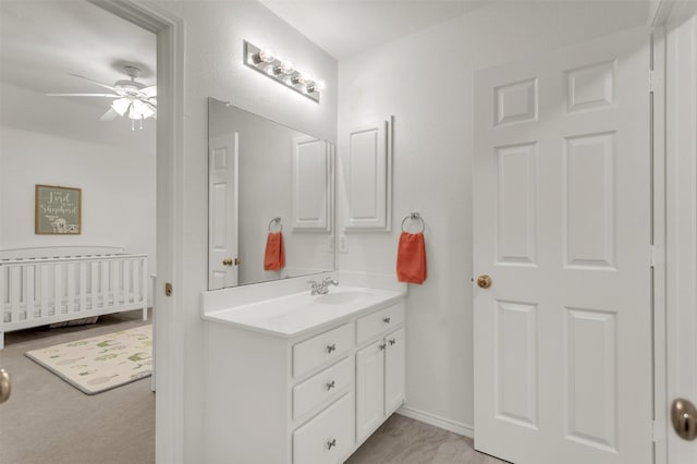 2081 Ashbourne Dr, Rockwall, TX 75087 - bathroom featuring ceiling fan, vanity, and baseboards