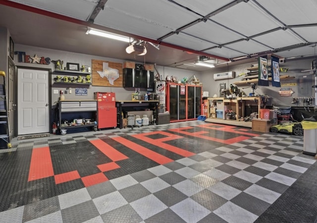 2081 Ashbourne Dr, Rockwall, TX 75087 - garage with a garage door opener and a workshop area