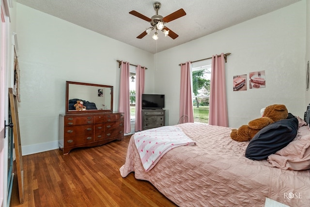 112 5th Ave, Coleman, TX 76834 - bedroom featuring wood finished floors, baseboards, and a ceiling fan