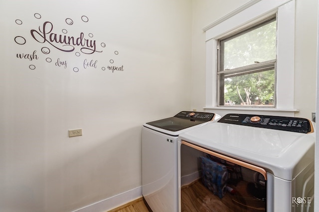 112 5th Ave, Coleman, TX 76834 - laundry room with independent washer and dryer, wood finished floors, and baseboards