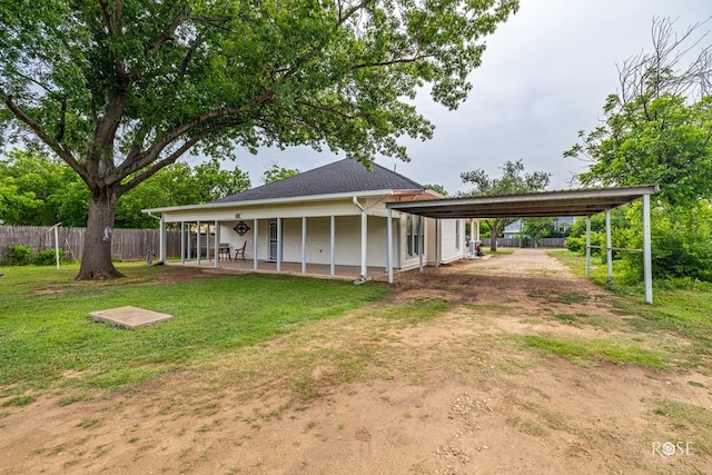 112 5th Ave, Coleman, TX 76834 - rear view of property with a carport and driveway