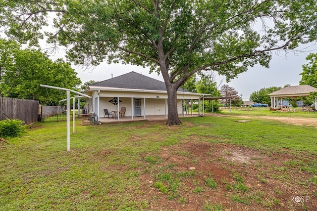112 5th Ave, Coleman, TX 76834 - rear view of property with a patio