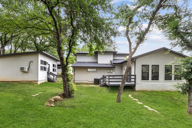 9132 Choctaw Trl, Flower Mound, TX 75022 - back of house with a deck, a lawn, and stucco siding