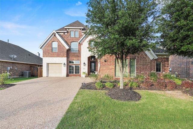 7224 Bucanero, Grand Prairie, TX 75054 - traditional home featuring central AC unit, an attached garage, brick siding, driveway, and a front yard