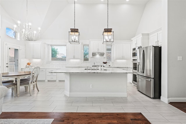 7224 Bucanero, Grand Prairie, TX 75054 - kitchen featuring stainless steel refrigerator with ice dispenser, high vaulted ceiling, a chandelier, backsplash, and white cabinetry