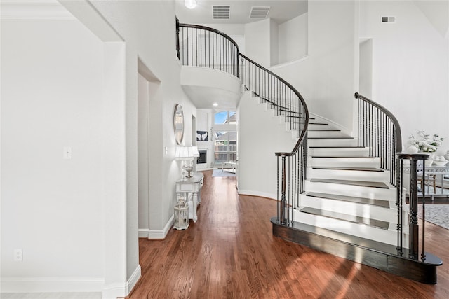 7224 Bucanero, Grand Prairie, TX 75054 - entrance foyer with wood finished floors, stairway, baseboards, and a towering ceiling