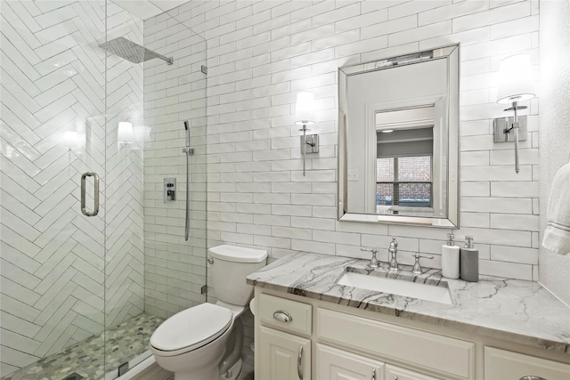 7224 Bucanero, Grand Prairie, TX 75054 - full bath featuring vanity, a stall shower, toilet, and tile walls