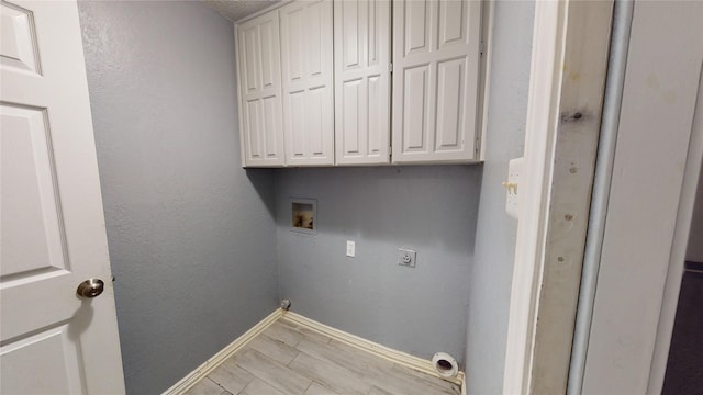 928 Thistle Ridge Ln, Arlington, TX 76017 - laundry room featuring hookup for a washing machine, electric dryer hookup, baseboards, and cabinet space