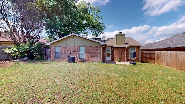 928 Thistle Ridge Ln, Arlington, TX 76017 - rear view of property with cooling unit, a chimney, and brick siding