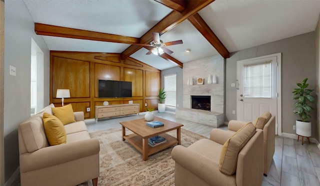 928 Thistle Ridge Ln, Arlington, TX 76017 - living area with a stone fireplace, ceiling fan, and baseboards