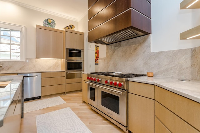 6406 Glendora Ave, Dallas, TX 75230 - kitchen with appliances with stainless steel finishes, premium range hood, ornamental molding, decorative backsplash, and light wood-style floors