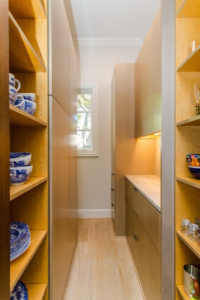 6406 Glendora Ave, Dallas, TX 75230 - bathroom featuring wood finished floors, ornamental molding, and baseboards