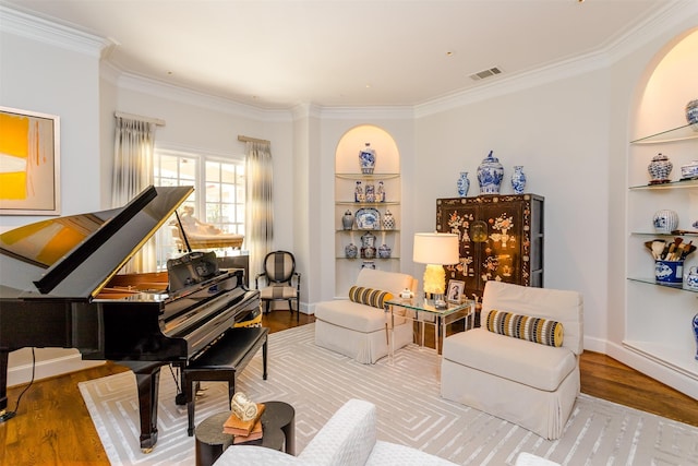 6406 Glendora Ave, Dallas, TX 75230 - living area featuring crown molding, built in shelves, and wood finished floors