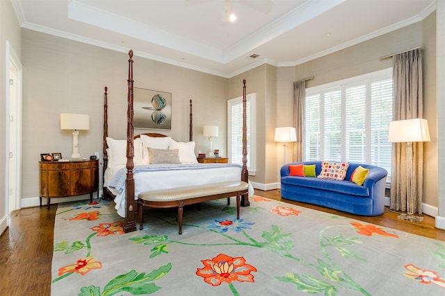 6406 Glendora Ave, Dallas, TX 75230 - bedroom with wood finished floors, baseboards, a raised ceiling, crown molding, and a ceiling fan