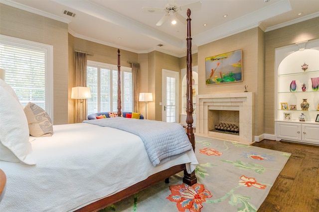 6406 Glendora Ave, Dallas, TX 75230 - bedroom featuring wood finished floors, a fireplace, crown molding, and recessed lighting