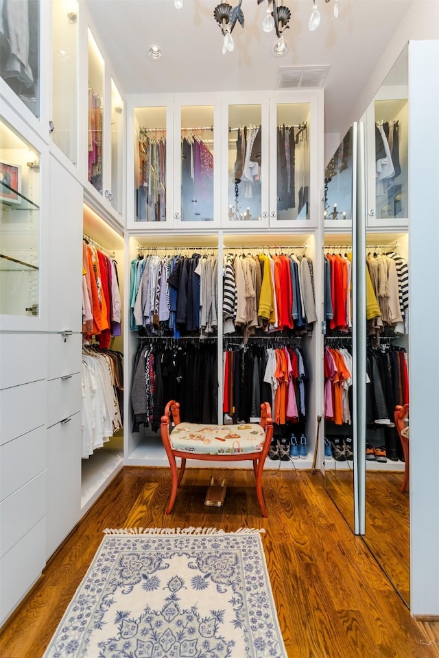 6406 Glendora Ave, Dallas, TX 75230 - walk in closet with wood finished floors