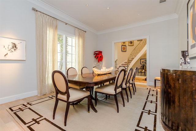 6406 Glendora Ave, Dallas, TX 75230 - dining room featuring crown molding, baseboards, and stairway