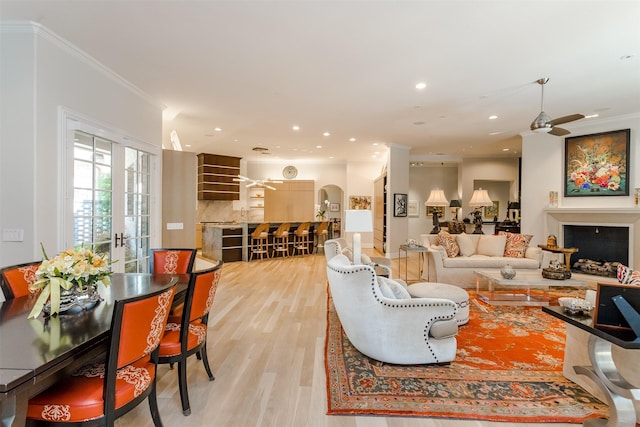 6406 Glendora Ave, Dallas, TX 75230 - living room with crown molding, light wood finished floors, ceiling fan, recessed lighting, and a fireplace