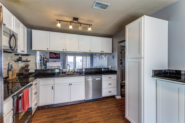 3808 River Birch Rd, Fort Worth, TX 76137 - kitchen with dishwasher, a sink, black microwave, electric range oven, and dark wood finished floors