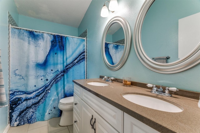 3808 River Birch Rd, Fort Worth, TX 76137 - bathroom with double vanity, toilet, tile patterned flooring, a textured ceiling, and a shower with curtain