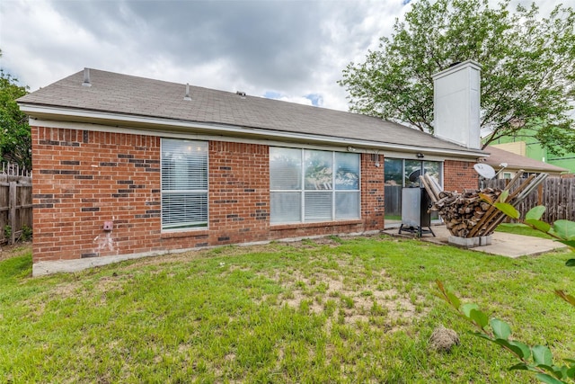 3808 River Birch Rd, Fort Worth, TX 76137 - back of house featuring brick siding, a patio, and a chimney