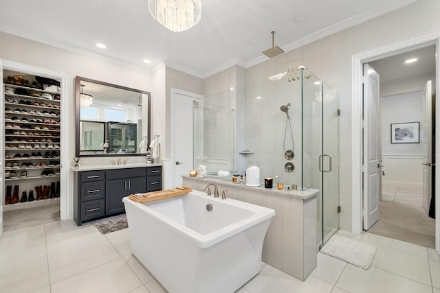 13580 Proud Clairon St, Frisco, TX 75035 - bathroom featuring a stall shower, ornamental molding, a freestanding tub, vanity, and tile patterned floors
