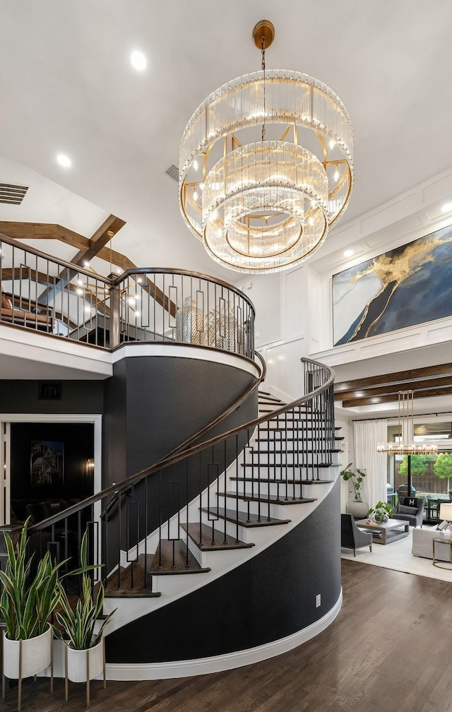13580 Proud Clairon St, Frisco, TX 75035 - staircase with a high ceiling, wood finished floors, a chandelier, and recessed lighting