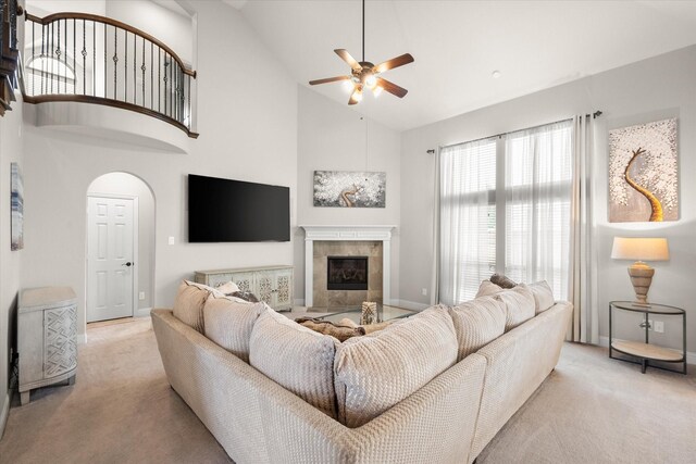 2604 Grand Colonial St, Grand Prairie, TX 75054 - living room with carpet, a ceiling fan, a fireplace, high vaulted ceiling, and baseboards