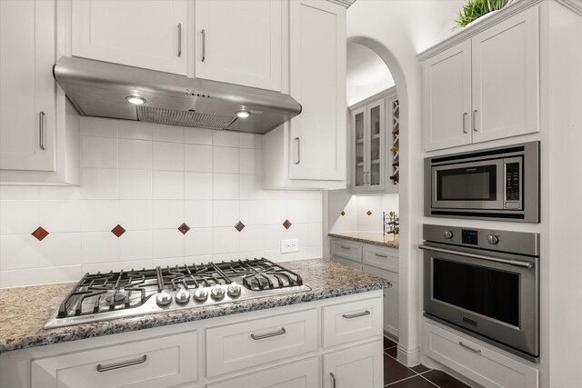 2604 Grand Colonial St, Grand Prairie, TX 75054 - kitchen with appliances with stainless steel finishes, under cabinet range hood, and white cabinets