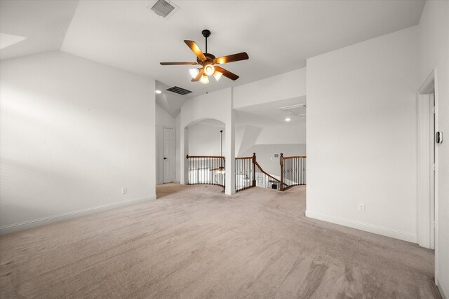 2604 Grand Colonial St, Grand Prairie, TX 75054 - carpeted spare room with attic access, ceiling fan, lofted ceiling, baseboards, and arched walkways
