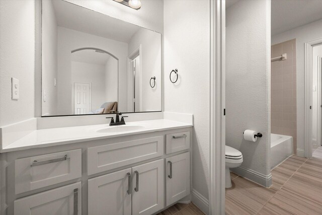 2604 Grand Colonial St, Grand Prairie, TX 75054 - bathroom with vanity, toilet, and shower / tub combination