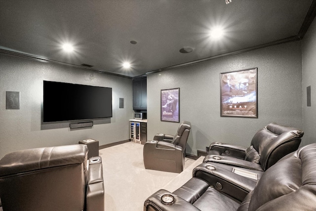 2604 Grand Colonial St, Grand Prairie, TX 75054 - home theater room featuring a textured wall, beverage cooler, light colored carpet, recessed lighting, and baseboards