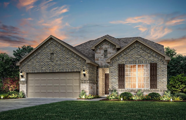 4267 Arlington Ave, Mckinney, TX 75071 - french country style house with concrete driveway, a garage, stone siding, brick siding, and a front yard