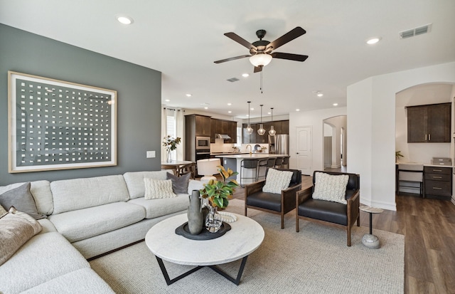 4267 Arlington Ave, Mckinney, TX 75071 - living room featuring arched walkways, a ceiling fan, dark wood finished floors, recessed lighting, and baseboards