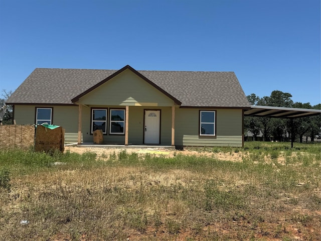 1013 Brown Ct, Poolville, TX 76487 - view of front of property featuring a shingled roof and a carport