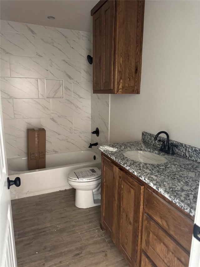 1013 Brown Ct, Poolville, TX 76487 - full bathroom with vanity, toilet, wood finished floors, and tub / shower combination