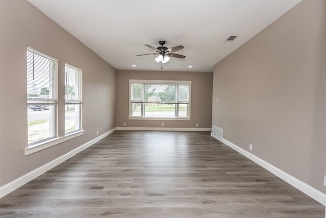 322 E Division St, Muenster, TX 76252 - unfurnished room with ceiling fan, wood finished floors, baseboards, and recessed lighting