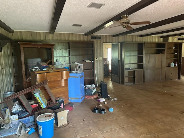 3182 E US Highway 84, Palestine, TX 75801 - misc room with a textured ceiling, a ceiling fan, beamed ceiling, and tile patterned flooring