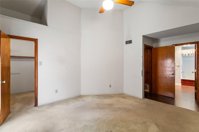 2025 Sancerre Ln, Carrollton, TX 75007 - unfurnished bedroom with carpet, high vaulted ceiling, ensuite bathroom, a closet, and a walk in closet