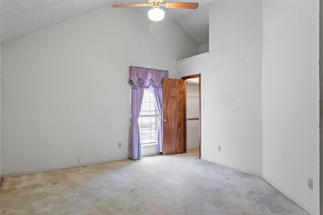 2025 Sancerre Ln, Carrollton, TX 75007 - carpeted empty room with a ceiling fan, high vaulted ceiling, and baseboards