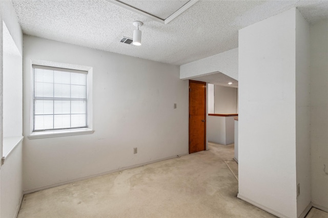 2025 Sancerre Ln, Carrollton, TX 75007 - spare room featuring light carpet and a textured ceiling