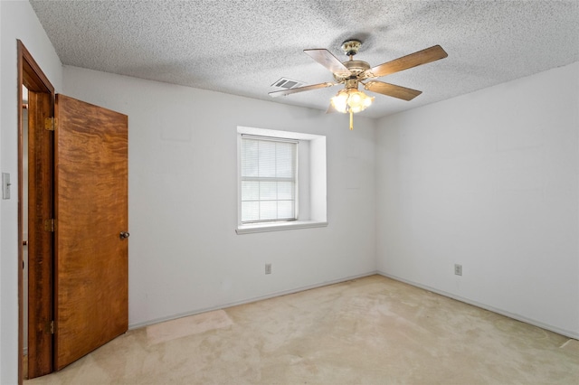 2025 Sancerre Ln, Carrollton, TX 75007 - empty room with carpet floors, a ceiling fan, a textured ceiling, and baseboards