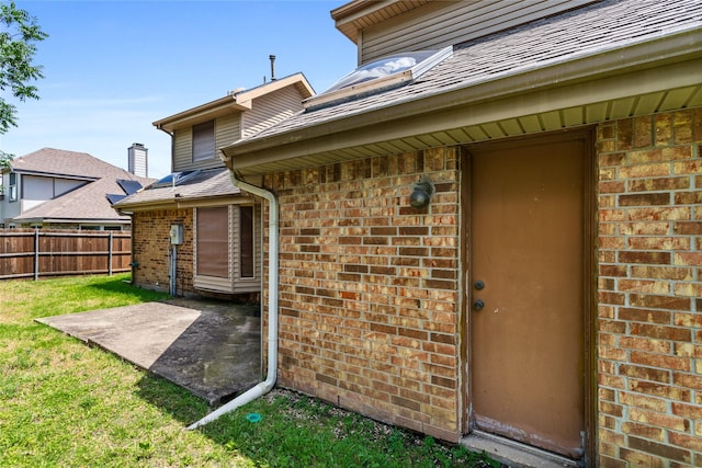 2025 Sancerre Ln, Carrollton, TX 75007 - property entrance with brick siding and a patio