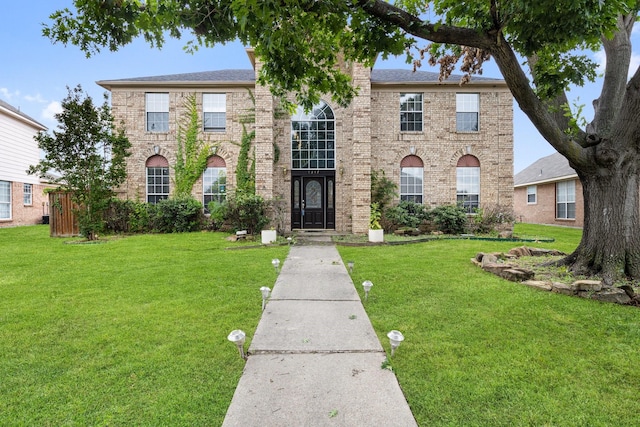 1317 Woodthorpe Dr, Mesquite, TX 75181 - view of front of house featuring a front yard and brick siding